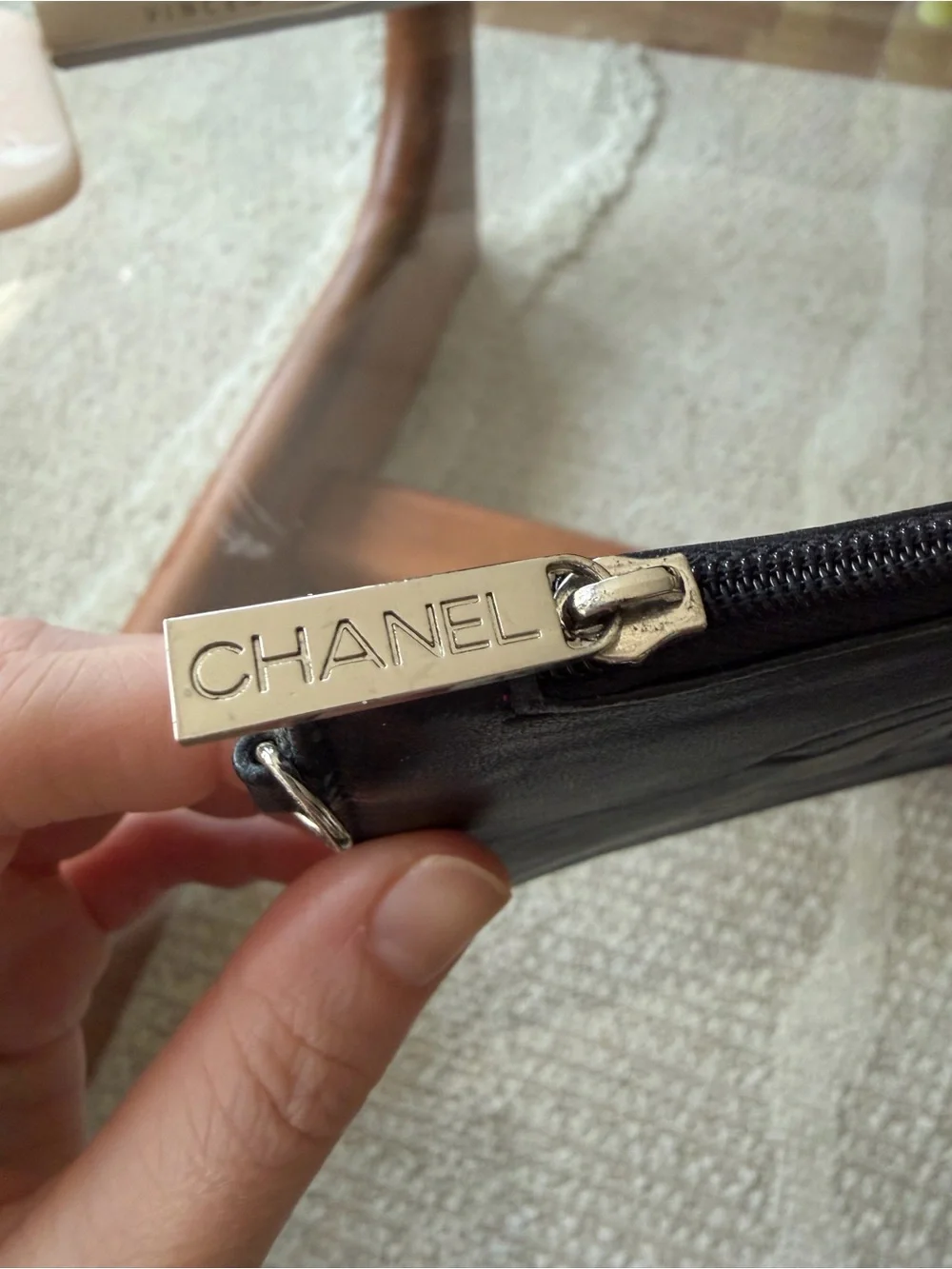CHANEL CC Black Leather Zip Wallet with Branded Silver Pull.